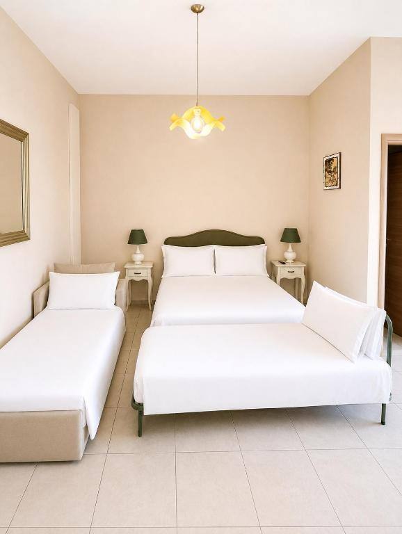 Camera Quadrupla con Balcone - B&B Sud Est Carmiano